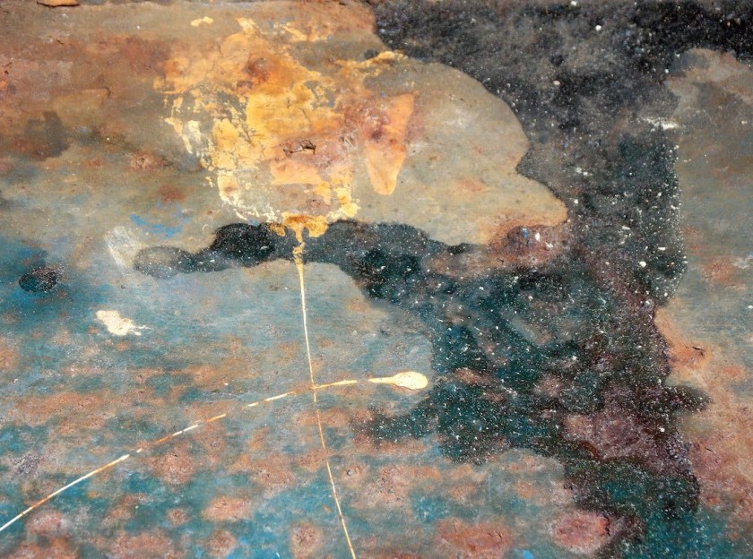 detail of rusty trash barrel in Fairhaven, MA